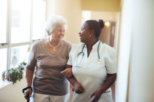 Careers at JFS Richmond. An RN assists an elderly woman.