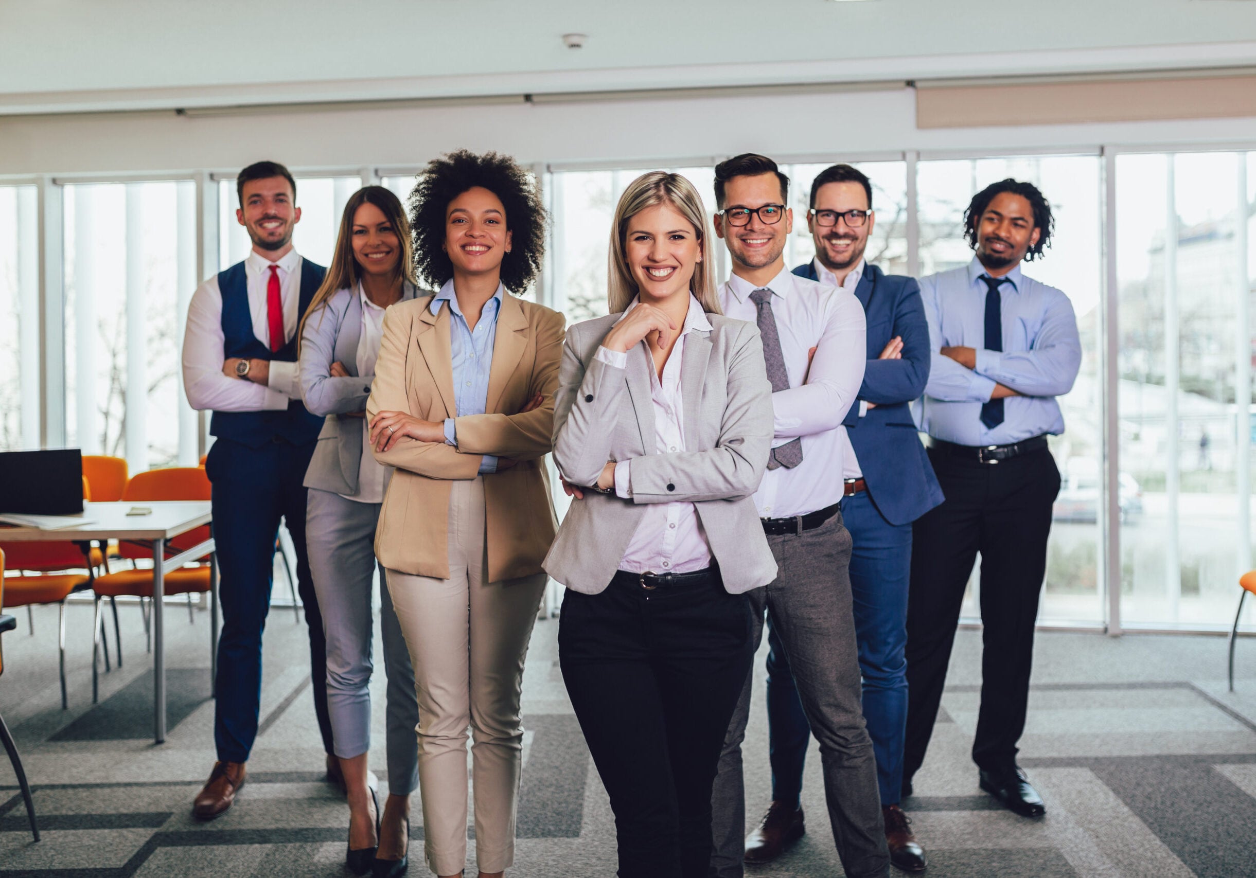 Group of happy business people and company staff in modern office, representig company.Selective focus.